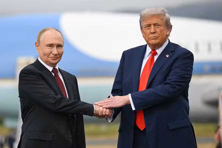 112025972-topshot-us-president-donald-trump-greets-russian-president-vladimir-putin-on-the-tarmac.avif