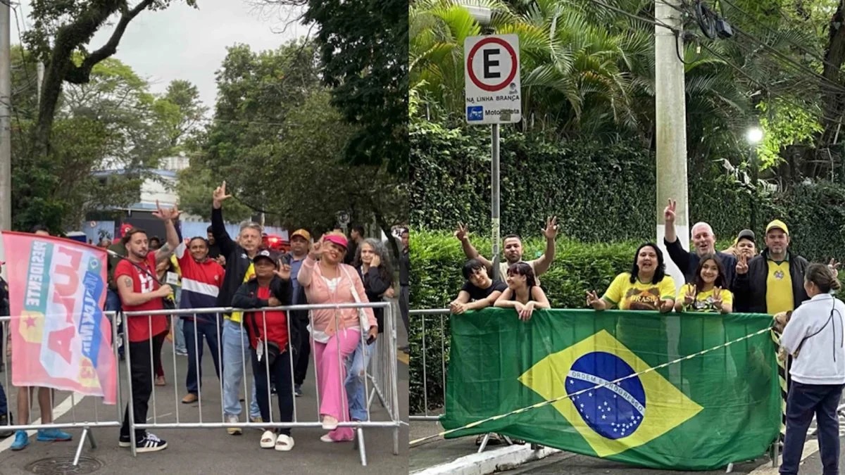 Grades separam apoiadores de Lula e Flávio Bolsonaro em frente à sede da Band, neste domingo (18.out.2026