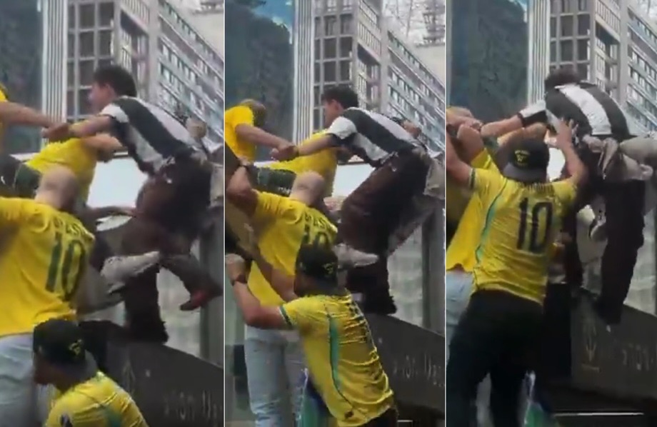 Manifestante impedem no último momento que petista enfurecido (de camisa listrada em preto e branco) subisse na cúpula do Metrô para atirar sinalizadores contra a multidão.